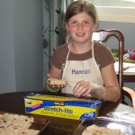 IMG_0596 Hannah wrapping up Rice Krispie treats in preparation for the sale